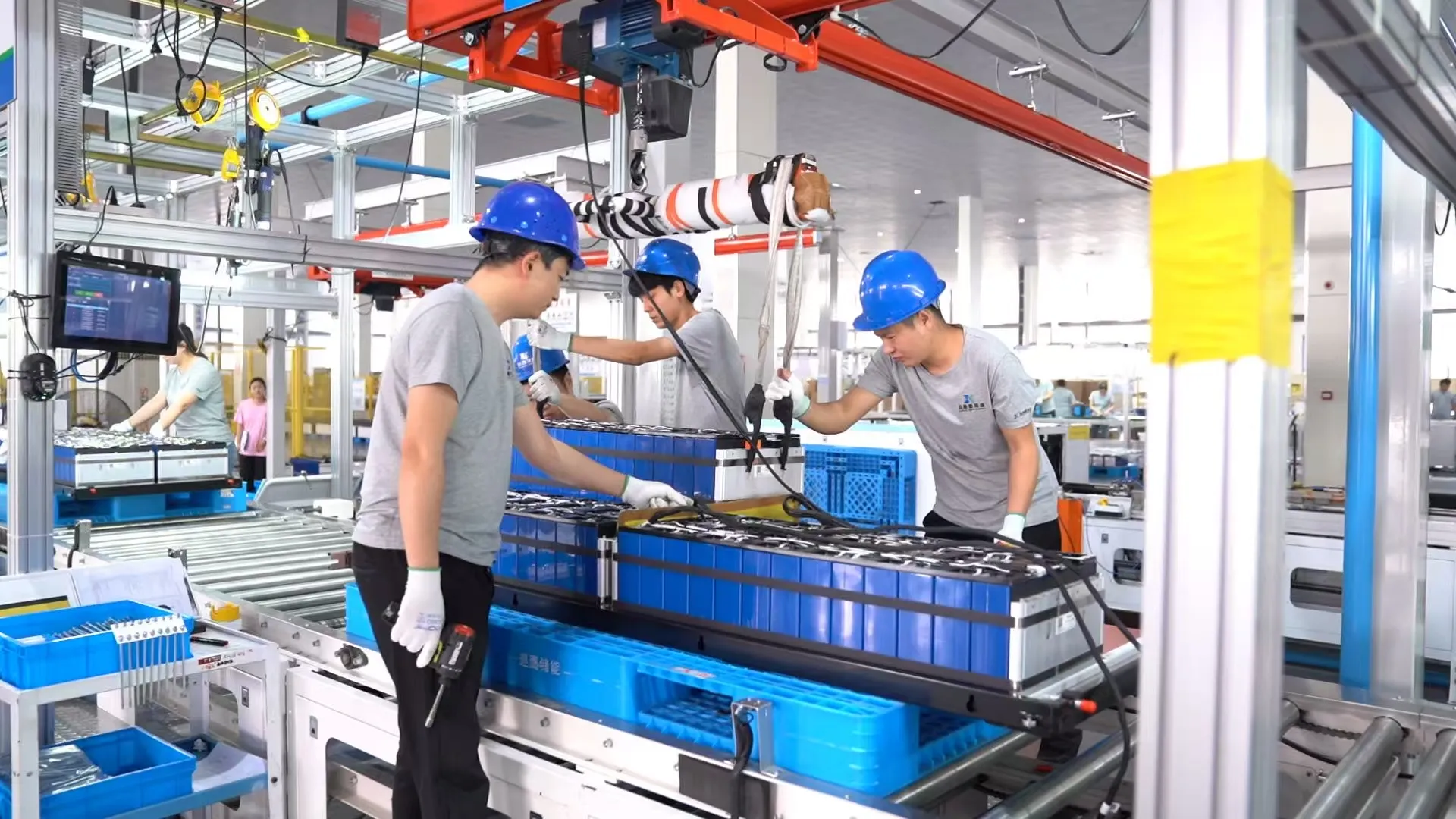 workers are assemblying battery modules.