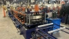 Hemming-reinforced shelf deck roll forming machine